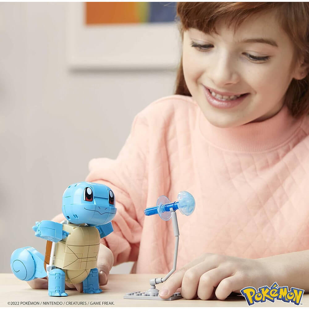 Child playing with MEGA Construx Pokémon Build and Show Squirtle 199 Piece Building Set