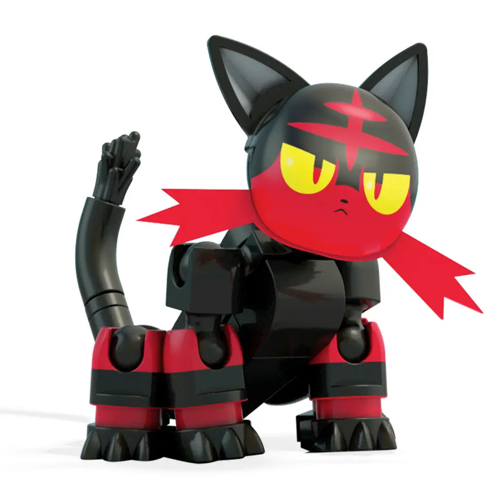 Close-up of buildable Litten figure from Mega Construx Pokémon set, featuring black body, red face and legs, yellow eyes, upright tail, and detailed brick construction for realistic play.