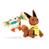 Mega Construx Pokémon figures of Eevee with large ears and fluffy tail leaping alongside Rowlet with wide eyes, green feather details, and orange feet.