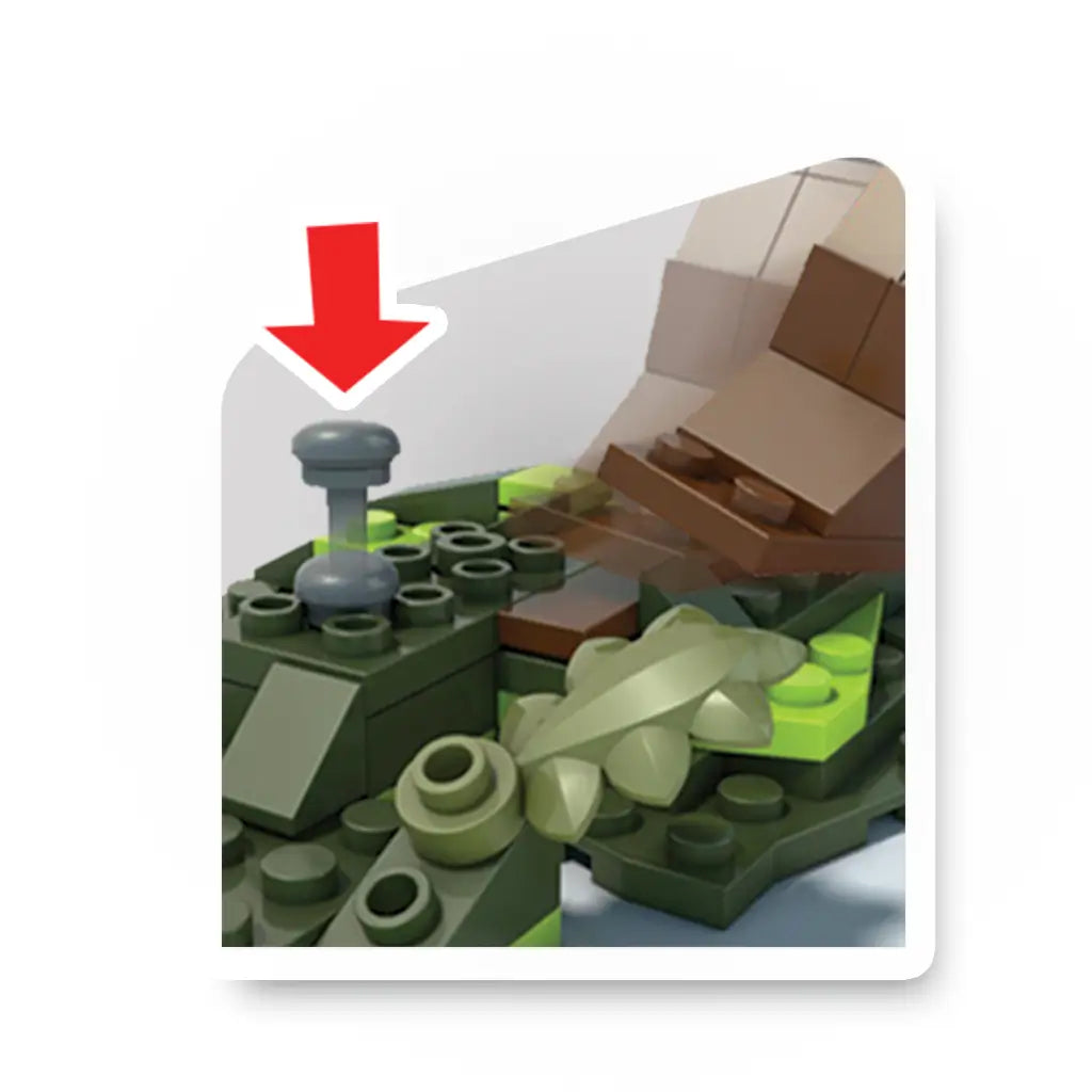 Close-up of Mega Construx Pokémon Rowlet vs Eevee set showing a gray pressure-activated lever built into green terrain bricks with surrounding blocky leaves.