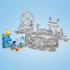 Mega Pokémon Aquatic Adventure set shown on left beside larger Pokémon building sets in grayscale, highlighting its bright blue waterfall blocks with Psyduck, Finneon, and Squirtle.