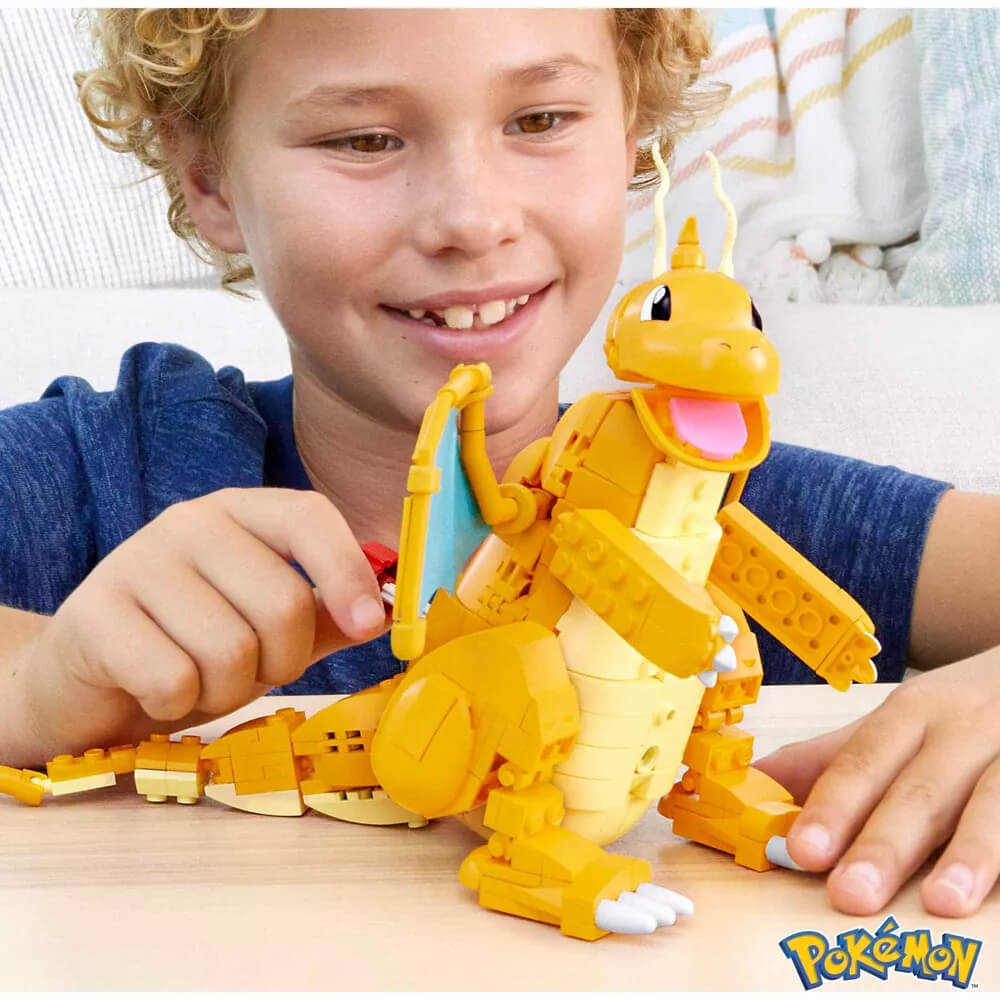 Child playing with MEGA Pokémon Dragonite 387 Piece Building Set