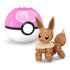 Mega Pokémon Eevee toy figure built from brown plastic bricks with cream mane, standing cheerfully beside a pink and white Love Ball storage case with heart-shaped symbol on the lid.