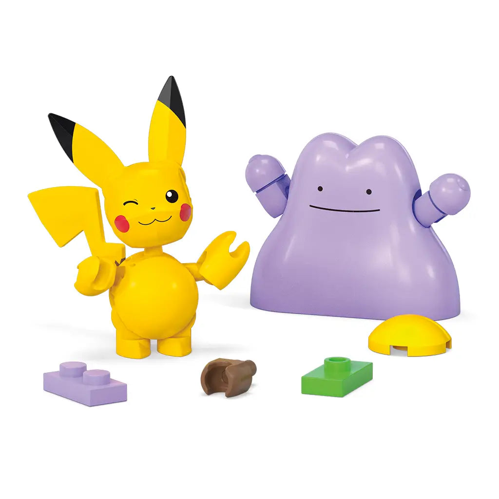 Mega Pokémon Pikachu and Ditto figures standing with loose building bricks in green, yellow, purple, and brown, showing additional accessory pieces included in the set.