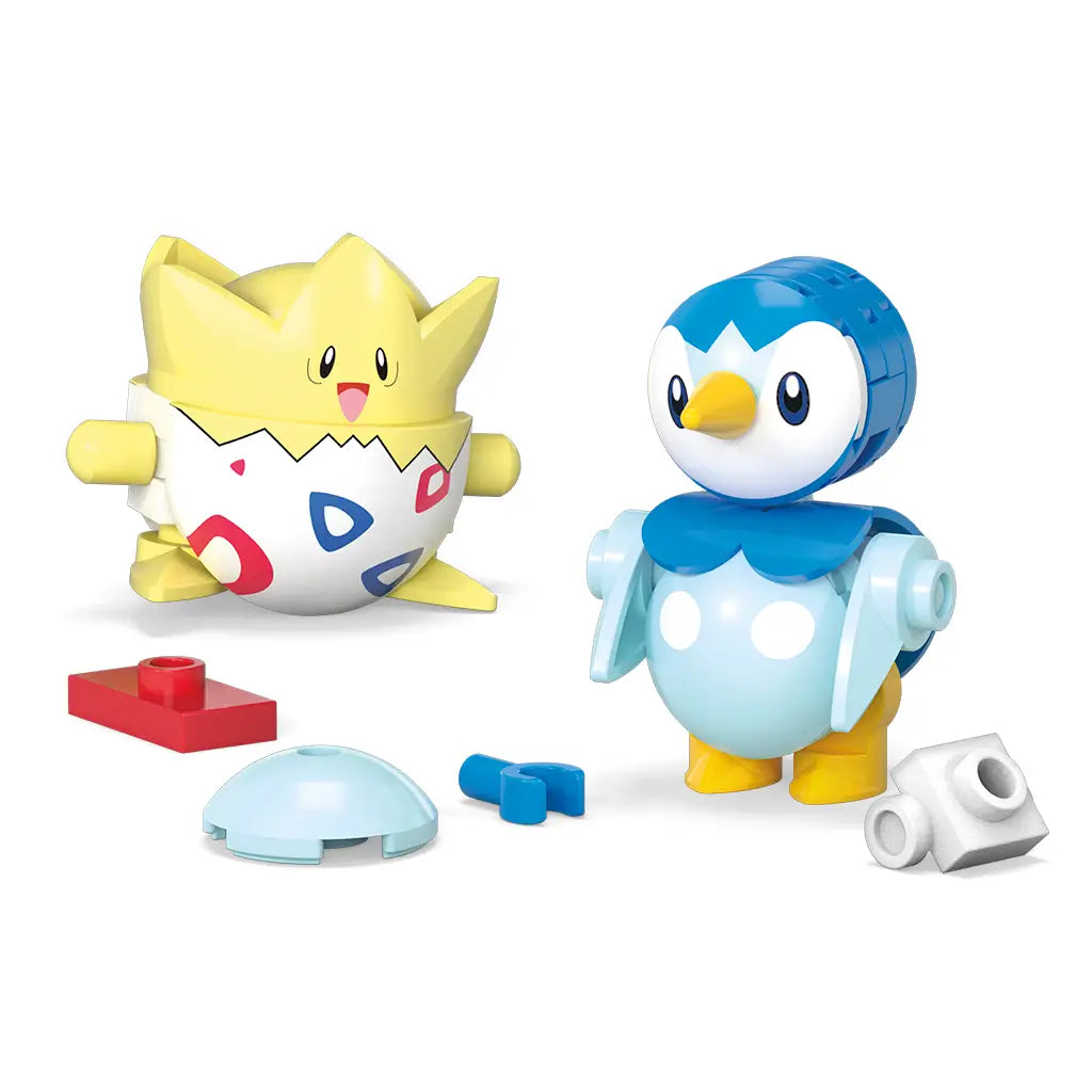 Mega Pokémon construction figures of Togepi and Piplup shown fully built with additional red, blue, and white interlocking brick pieces placed neatly around them on a white background.