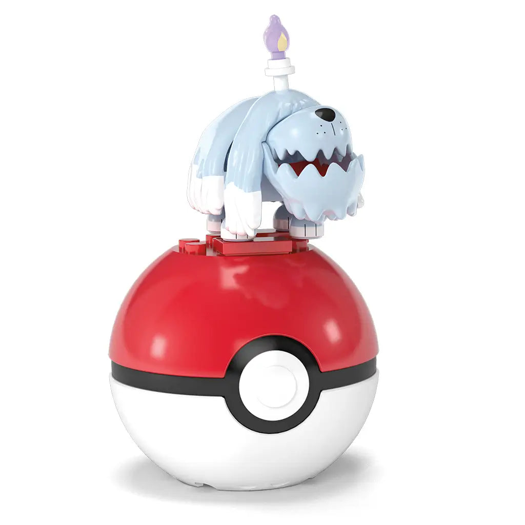 Mega Pokémon Greavard figure posed atop red and white Poké Ball, showcasing light blue shaggy fur, white paws, and translucent purple flame detail. This Mega Construx toy set offers build-and-play fun for Pokémon fans ages six and older, combining display and play features in one collectible set.