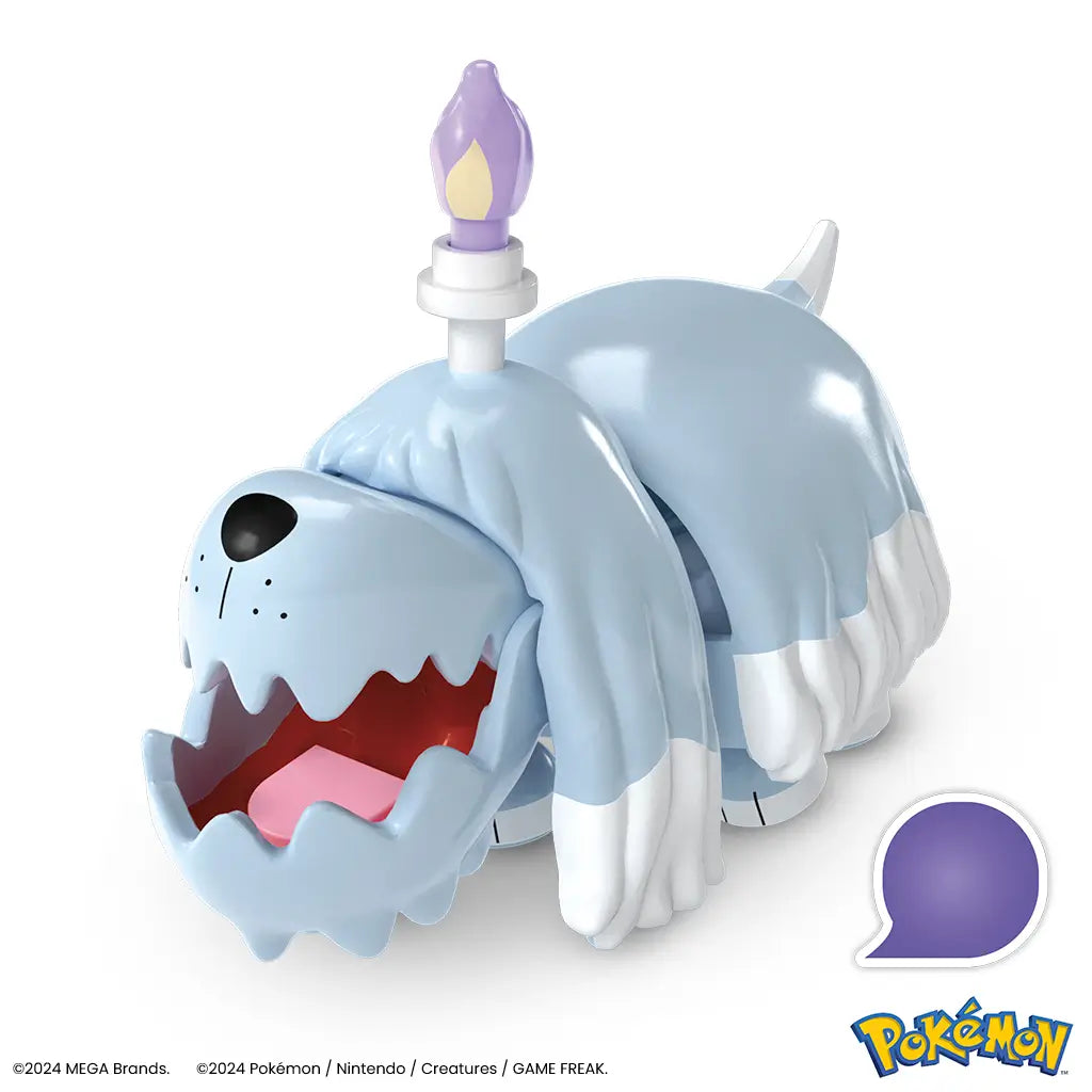 Close-up of assembled Mega Pokémon Greavard figure, showing shaggy light blue fur, open mouth with red interior, and candle flame on top of head. This Mega Construx toy set offers build-and-play fun for Pokémon fans ages six and older, combining display and play features in one collectible set.