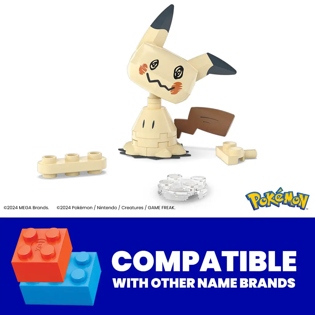 Close-up of Mega Pokémon Mimikyu building set pieces, showing beige and brown bricks forming the ghost Pokémon figure, with compatibility statement for other brands.