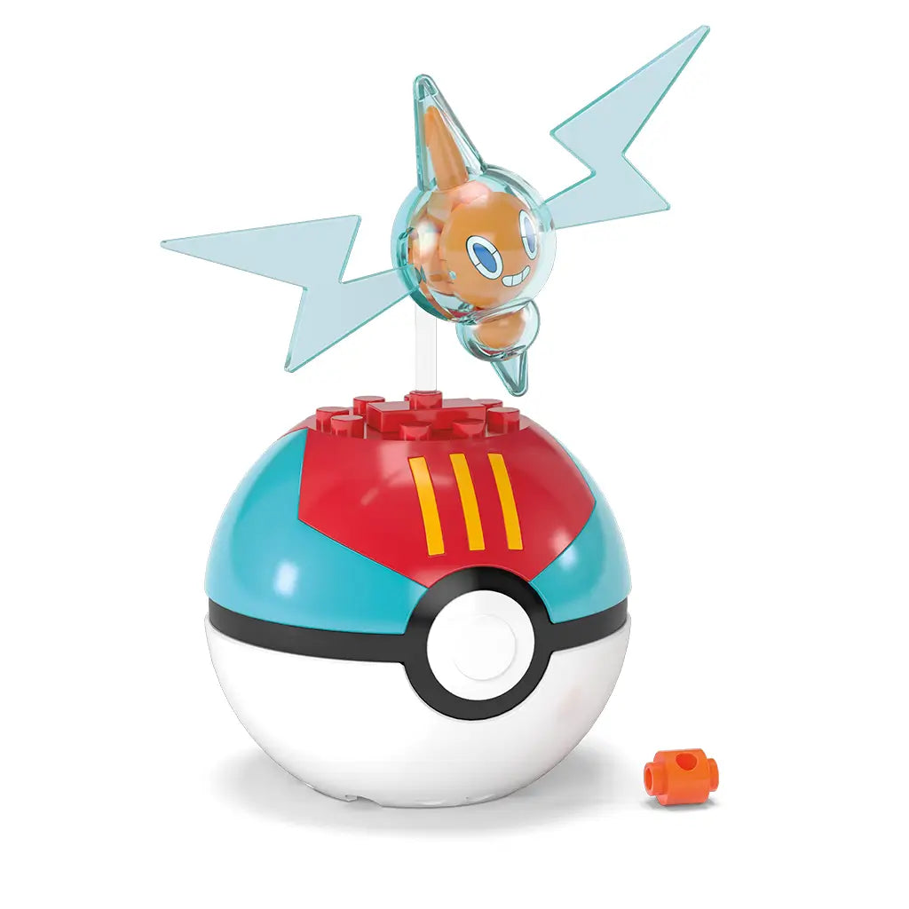 Close-up of MEGA Pokémon Rotom figure with translucent blue wings posed above red and blue Poké Ball base, shown with small orange connector piece on white background.