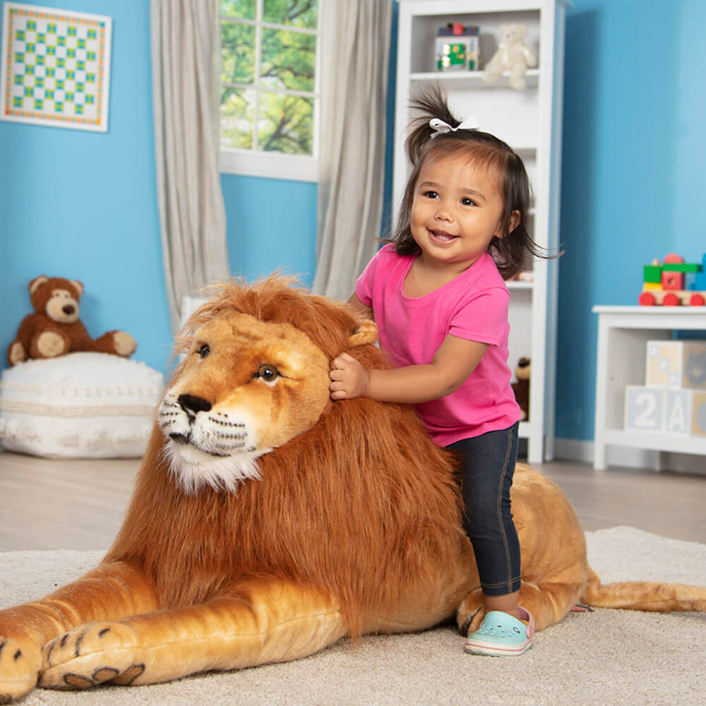 Little Girls sitting on the Melissa and Doug Giant Lion Stuffed Animal