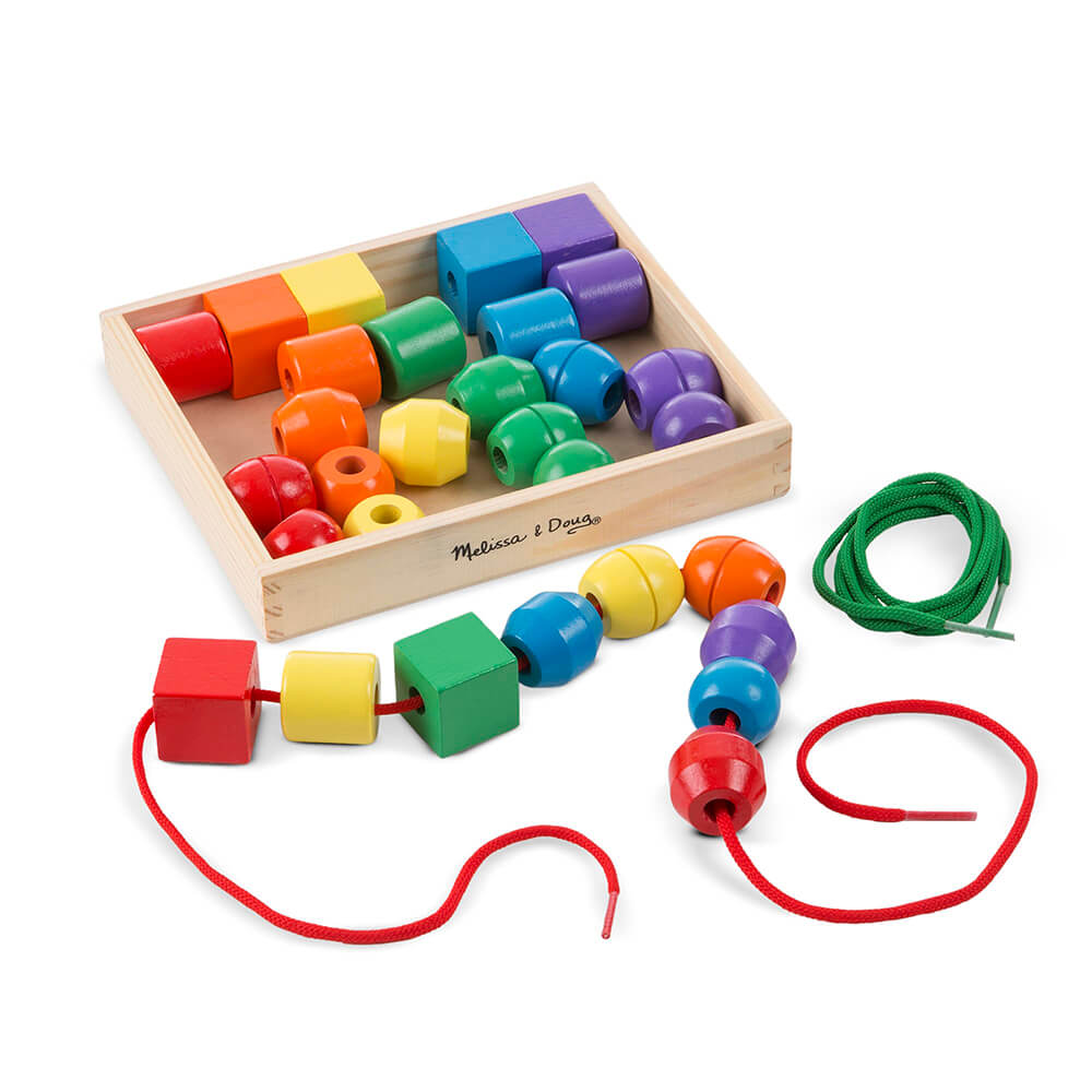 Melissa and Doug Primary Lacing Beads Set shown with packaging and two ropes removed. One of the ropes is filled with lacing beads
