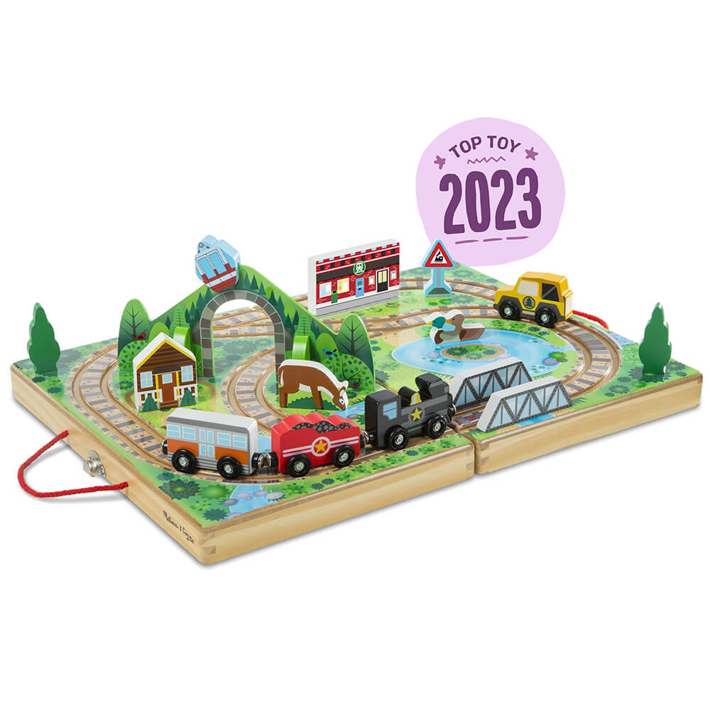 Open box showing the set of the Melissa and Doug Take-Along Railroad Play Set announcing it is a top toy of 2023