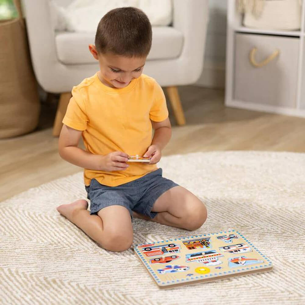 Image of boy wearing yellow shirt playing the puzzle 
