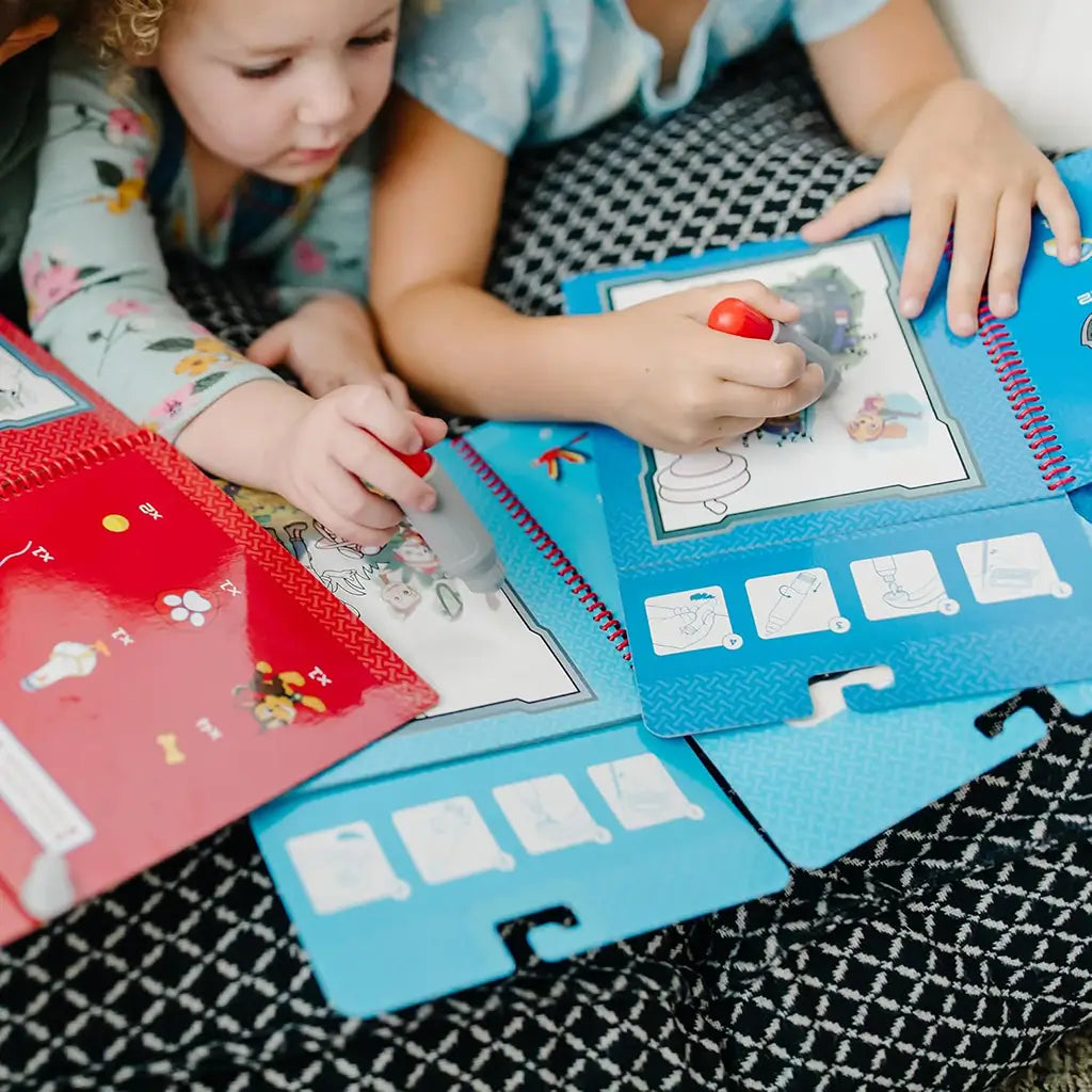 Melissa & Doug PAW Patrol Water Wow! reusable coloring activity set with red spiral notebook, refillable water pen, and search-and-find pages that reveal colorful scenes when wet.