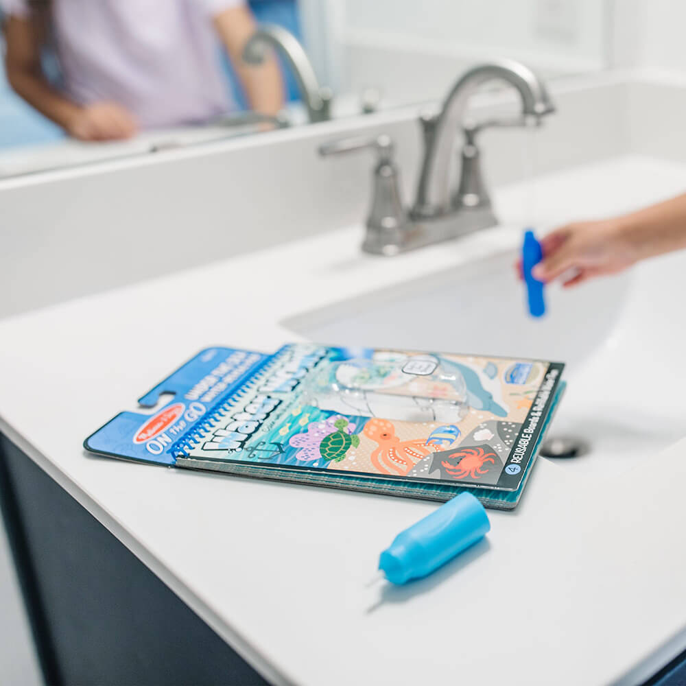 Filling up the pen with water and the Melissa and Doug Water Wow! Under the Sea Water-Reveal On the Go Travel Activity Pad