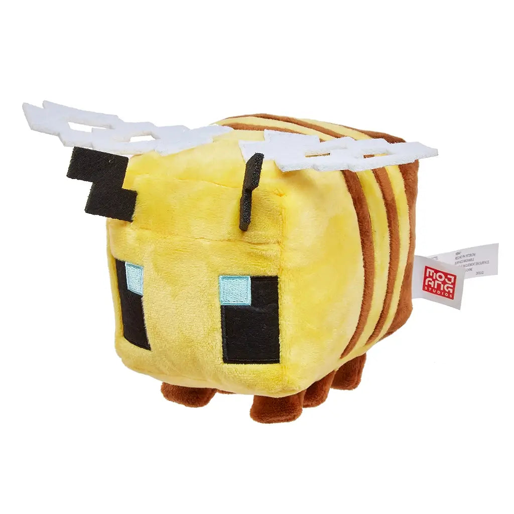 Minecraft bee plush shown at an angled view with yellow and brown striped plush fabric, cube-shaped body, stitched pixel eyes, white layered wings, and soft legs, highlighting its 8-inch size and game-accurate design on a white background.