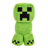 Minecraft Creeper plush toy in bright green soft fabric with fuzzy texture, blocky square head and body, black pixel-style face, four stubby legs, and upright sitting pose on a clean white background.
