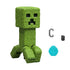 Detailed closeup of Minecraft Creeper toy showing green textured blocky surface, square head, and iconic pixelated black eyes and mouth from the popular video game.