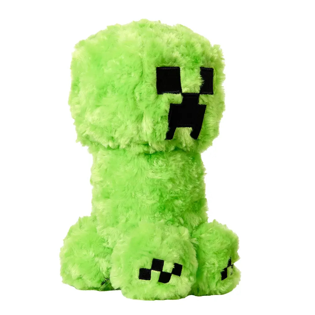 Green Minecraft Creeper plush figure made of fuzzy fabric with pixelated black stitched face, displayed in angled view to show front and side details.
