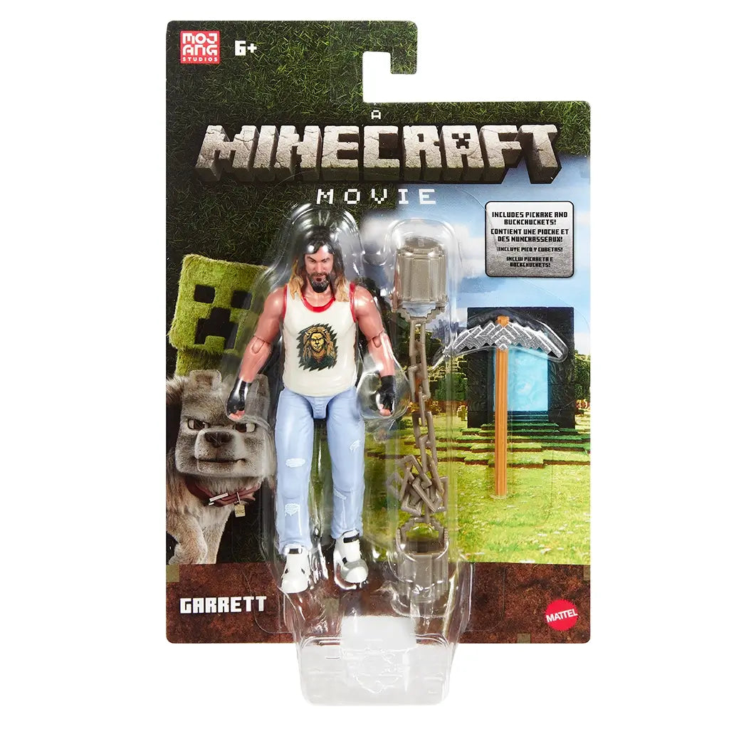 Minecraft Movie Garrett action figure packaging features green and brown pixelated background, clear plastic blister, Minecraft Movie logo, Mattel branding, and visible pickaxe and chain accessories, designed for retail display.