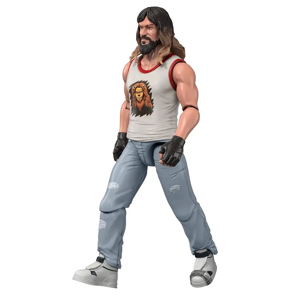 Minecraft Movie Garrett action figure right angled view shows long hair sculpt, beard detail, lion chest graphic, textured jeans, and sneaker footwear, emphasizing realistic proportions and side profile design.