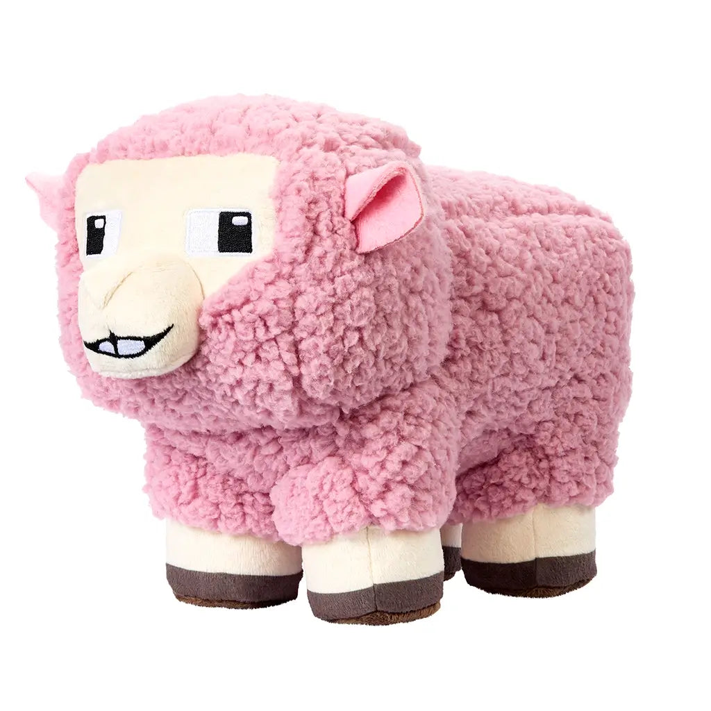 Angled view of Minecraft Movie pink sheep 8-inch plush, displaying soft pink fleece texture, cream-colored pixel face, stitched nose and mouth, square embroidered eyes, and sturdy blocky body shape.