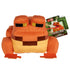 Minecraft orange frog plush doll in orange and tan colors, soft plush polyester fabric, blocky frog form with raised square eyes, shown with branded hang tag for retail identification on a white background.