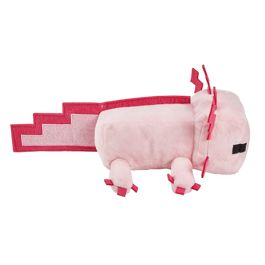 Minecraft pink axolotl plush side view showing soft blush pink fabric, blocky game-style silhouette, flat pixel-edged tail, red felt gill shapes, and short plush legs, accurately representing the 8-inch axolotl character against white.