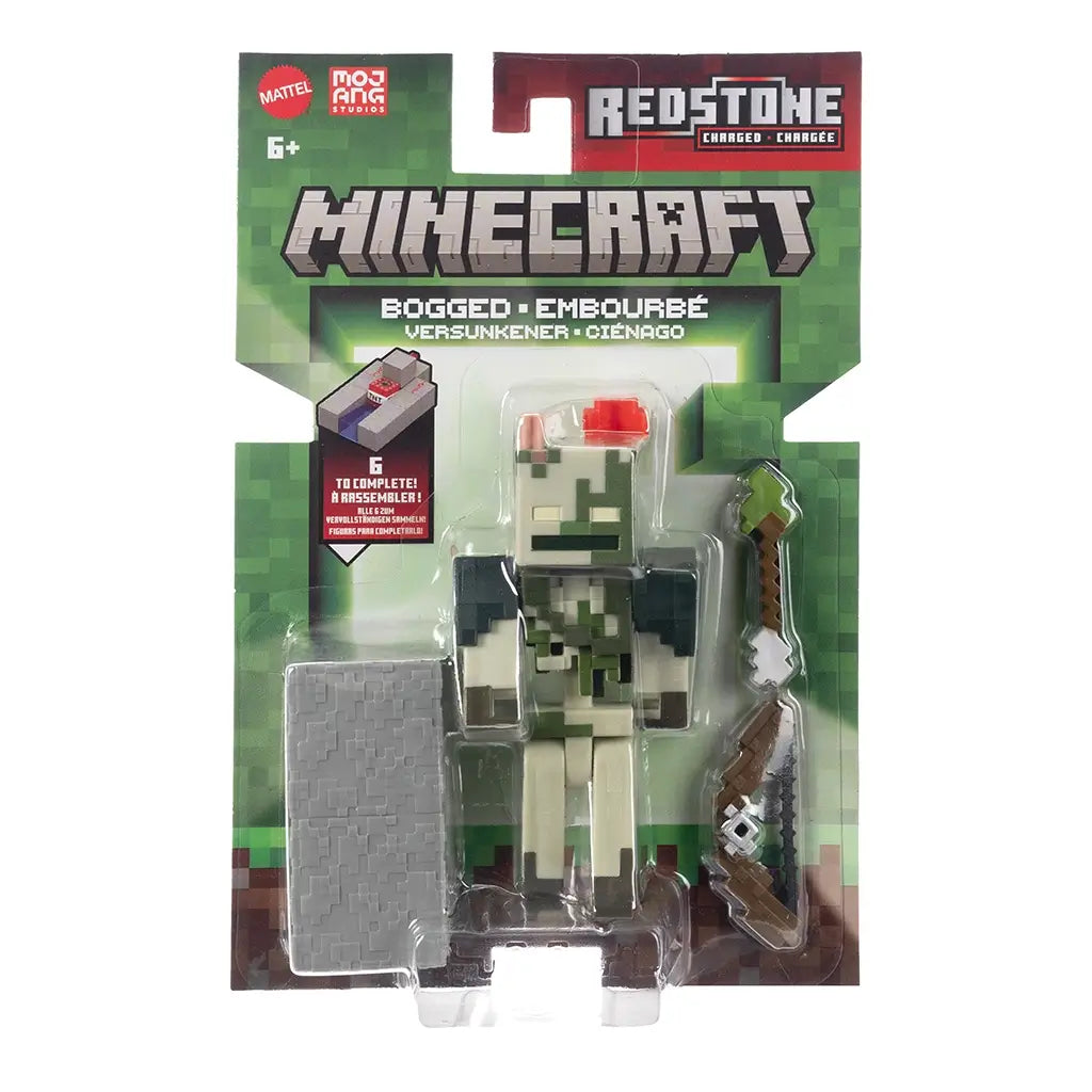 Minecraft Redstone Charged Bogged retail packaging with clear blister, displaying the Bogged figure, pixel bow accessory, gray redstone charger block, Minecraft branding, Mojang Studios logo, and green card front design.