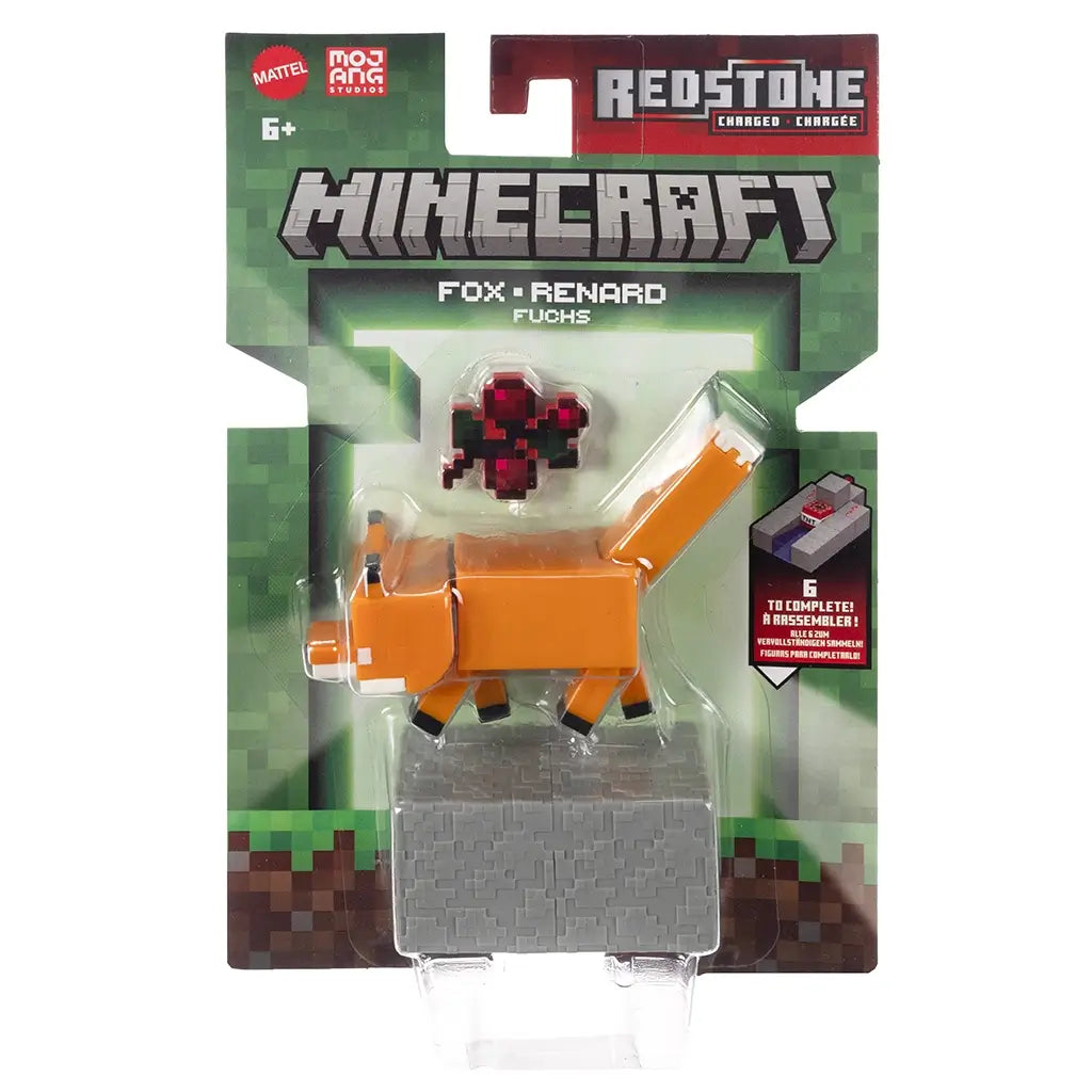 Minecraft Redstone Charged Fox retail packaging with clear blister, displaying the orange fox figure, sweet berry accessory, gray redstone charger block, Minecraft branding, and Mojang Studios logos on a green card front.