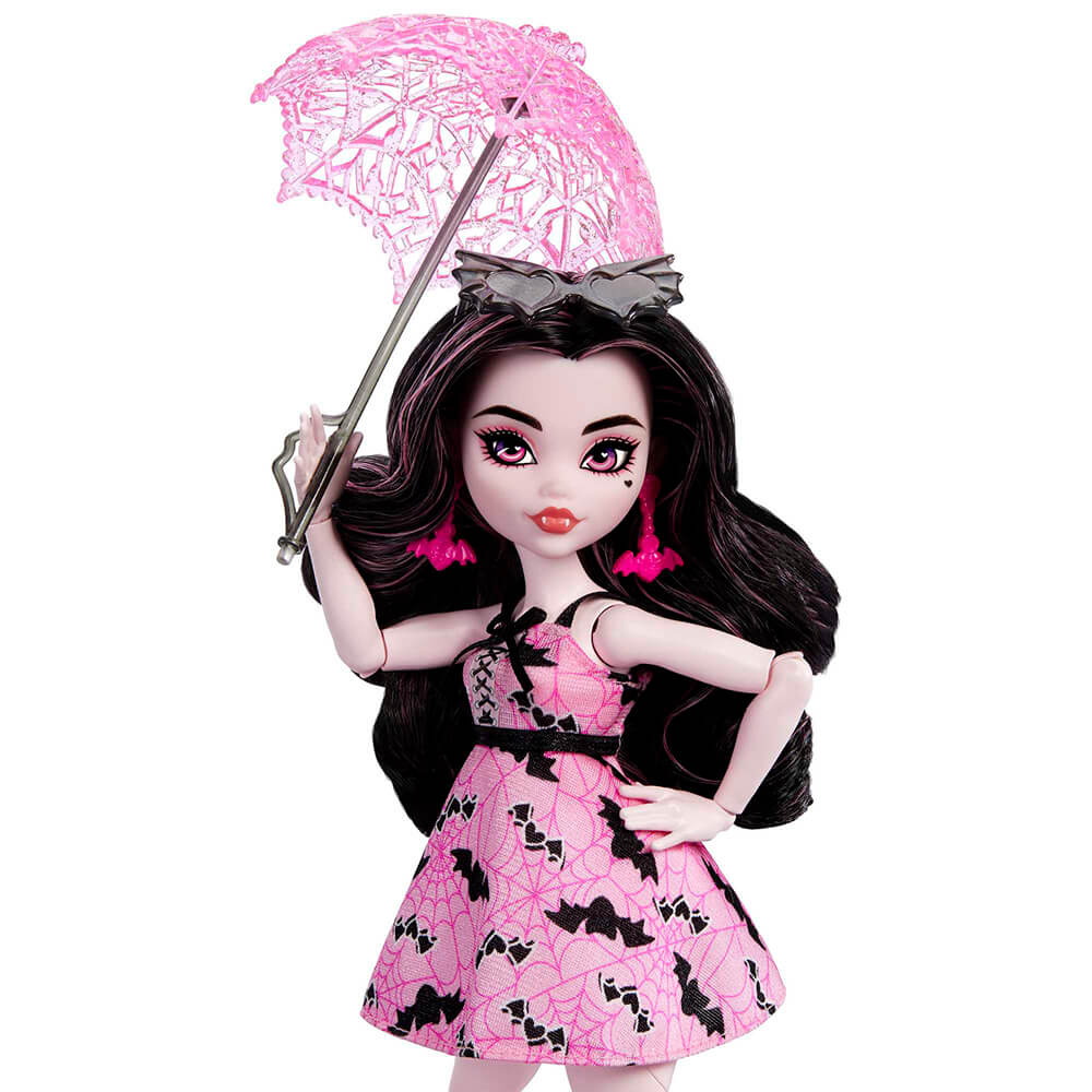 Close up of doll holding umbrella from the Monster High Draculaura Bite in the Park Doll and Playset