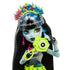 Close-up of Monster High Frankie Stein doll’s face with mismatched eye colors, bold makeup, silver crown, and neon flower headband for a striking festival look.