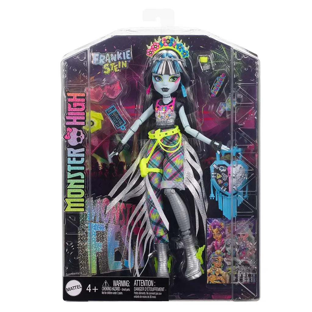 Monster High Frankie Stein fashion doll in glittery festival outfit, displayed in retail packaging with colorful accessories and Monster Fest branding on the front.