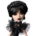 Monster High Rave N’ Wednesday fashion doll with black braided updo, gothic makeup, ruffled sheer black top, and skull-accent earrings, showcasing her spooky-chic aesthetic.