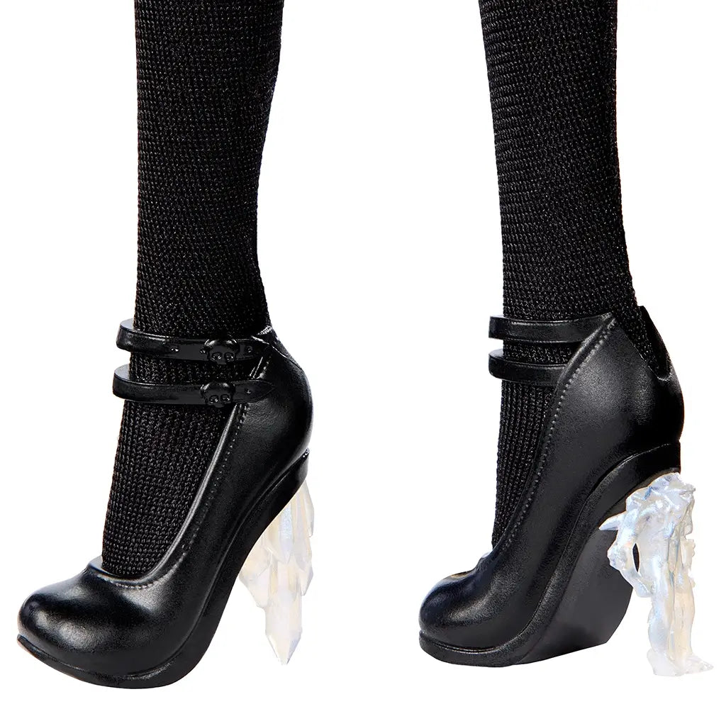 Monster High Rave N’ Wednesday doll wearing black high-heeled shoes with double straps, skull details, and translucent jagged crystal-style heels, paired with textured black tights.