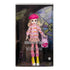 Monster High Enid Sinclair doll packaged in window box with gothic stained-glass backdrop, wearing pink sweater, plaid skirt, yellow boots, and holding heart-print pink bag.