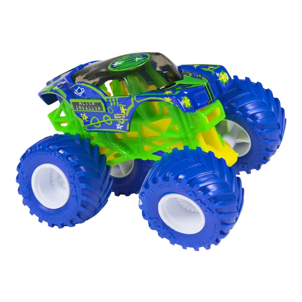 Monster Jam Alien Invasion toy truck in blue and green painted metal with alien graphics, oversized textured rubber tires, lifted suspension frame, displayed on a clean white studio background.