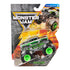 Monster Jam Avenger toy truck in green and gray die-cast metal with flame graphics and oversized black rubber tires, displayed in retail packaging with bold branding and action-themed background artwork.