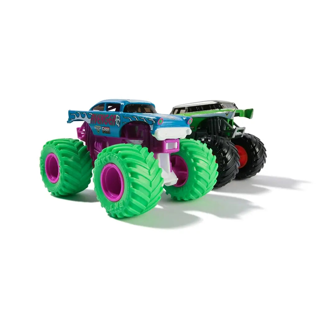 Monster Jam Avenger truck in blue and purple plastic with stylized graphics and chunky green treaded wheels designed for racing play displayed in a minimal studio setting.