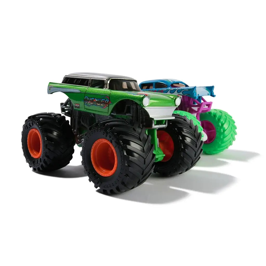 Monster Jam Avenger truck in metallic green plastic with black chassis and oversized rubber tires designed for stunt play shown in a clean angled studio view with neutral background.
