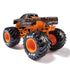 Rear angled view of Monster Jam Bad Company 1:64 diecast monster truck, with orange chassis, oversized black BKT tires, and grungy black-and-white graphic body.