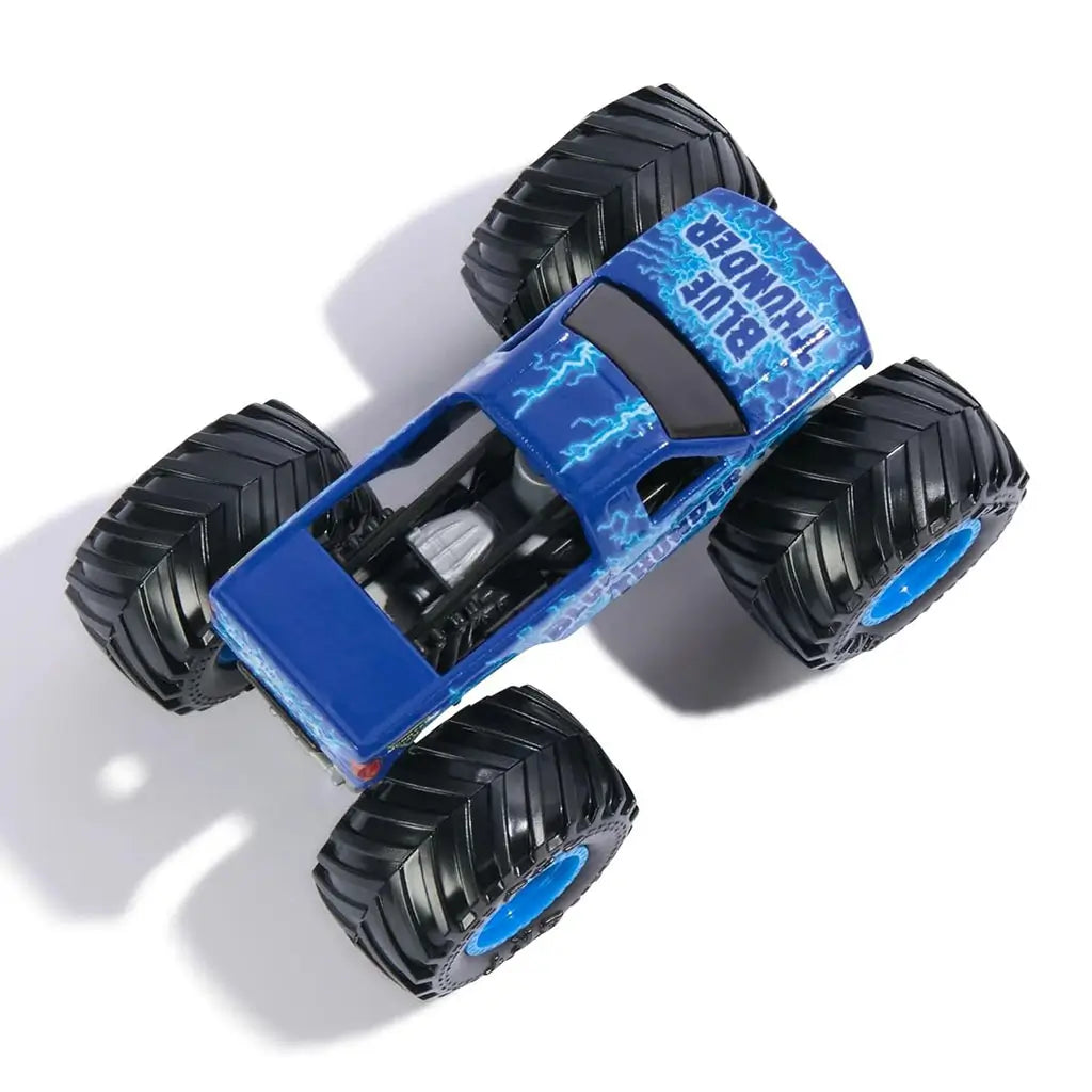 Top view of Monster Jam Blue Thunder diecast truck with vivid lightning bolt patterns across the body, chunky black wheels, and deep blue rims emphasizing high-energy design.