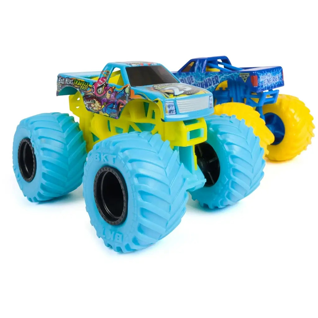 Monster Jam Bad News Travels Fast truck in teal and yellow plastic with detailed illustrated body graphics and large blue treaded wheels designed for stunt play displayed on a clean white background.
