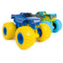 Monster Jam Blue Thunder truck in deep blue plastic with lightning graphics and oversized bright yellow wheels designed for racing and stunt play shown in a minimal studio setting with neutral background.