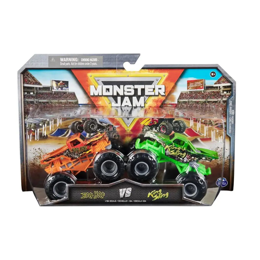 Front packaging of Monster Jam Bog Hog vs King Sling 1:64 scale 2-pack featuring bold graphics, clear display box, and vibrant arena background with dirt-flying monster trucks.
