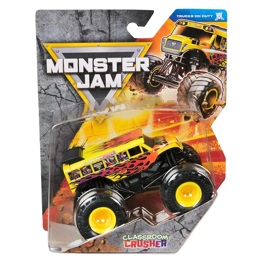 Packaged Classroom Crusher 1:64 scale monster truck displayed in a clear blister pack with fiery yellow artwork, Monster Jam branding, and the toy showcased against a cracked-asphalt themed card.