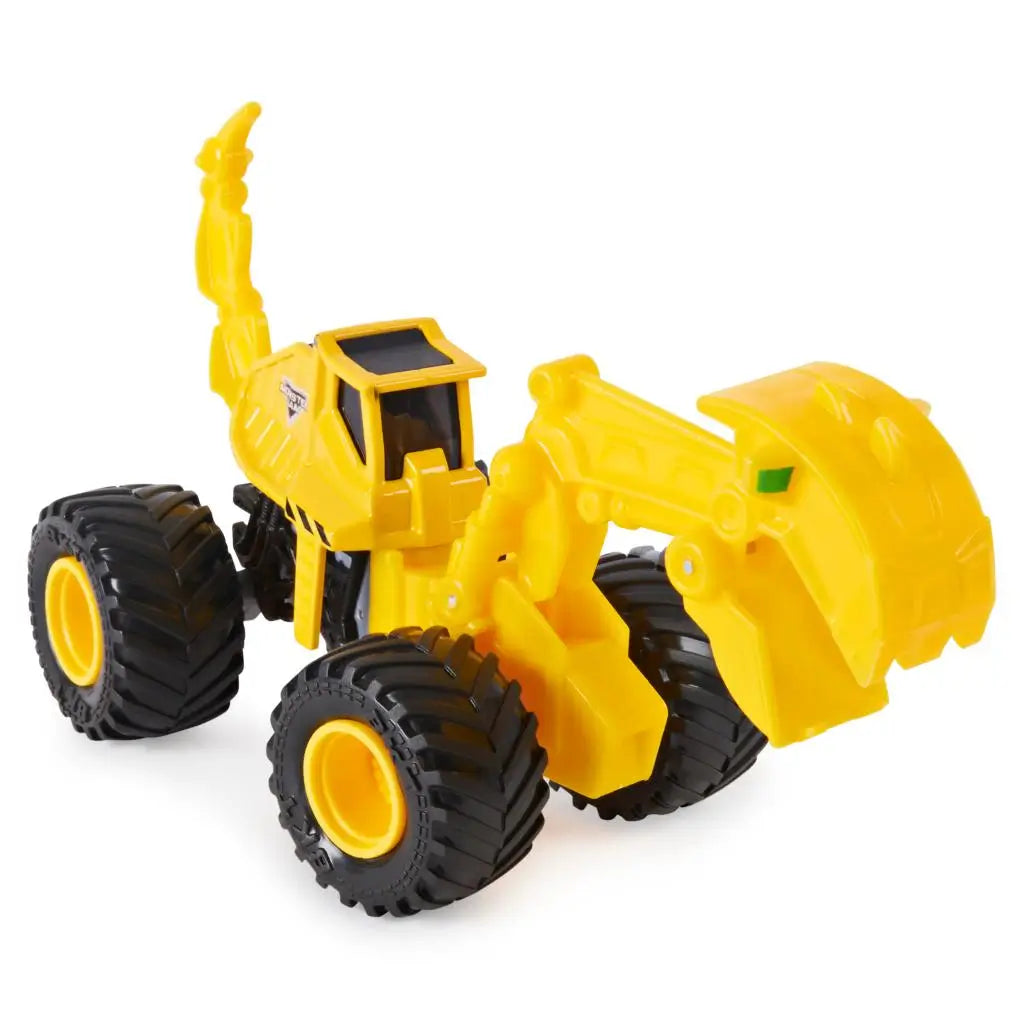 Monster Jam Dugg excavator toy in bright yellow plastic with textured details and movable scoop arm, compact vehicle form on large rubber tires, displayed at an angled view on a white background.