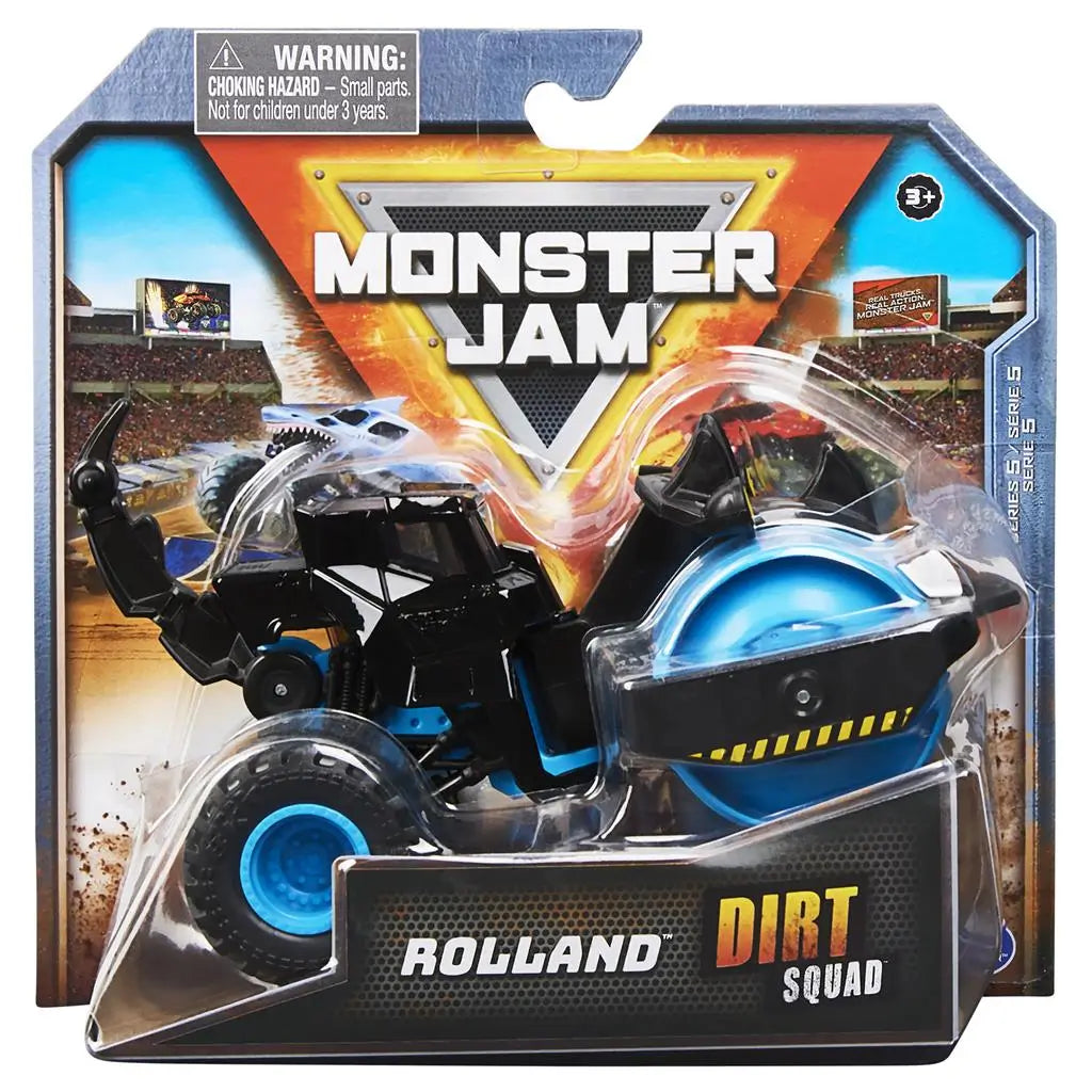 Monster Jam Rolland Dirt Squad toy in black and blue plastic with roller drum front and hazard stripe details, compact construction vehicle shape on large rubber tires, displayed in branded retail packaging with stadium background.