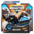 Monster Jam Rolland Dirt Squad toy in black and blue plastic with roller drum front and hazard stripe details, compact construction vehicle shape on large rubber tires, displayed in branded retail packaging with stadium background.