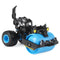 Monster Jam Rolland paver truck in black and bright blue plastic with smooth roller drum and claw-like front detail, compact vehicle form on oversized rubber tires, shown on a clean white studio background.
